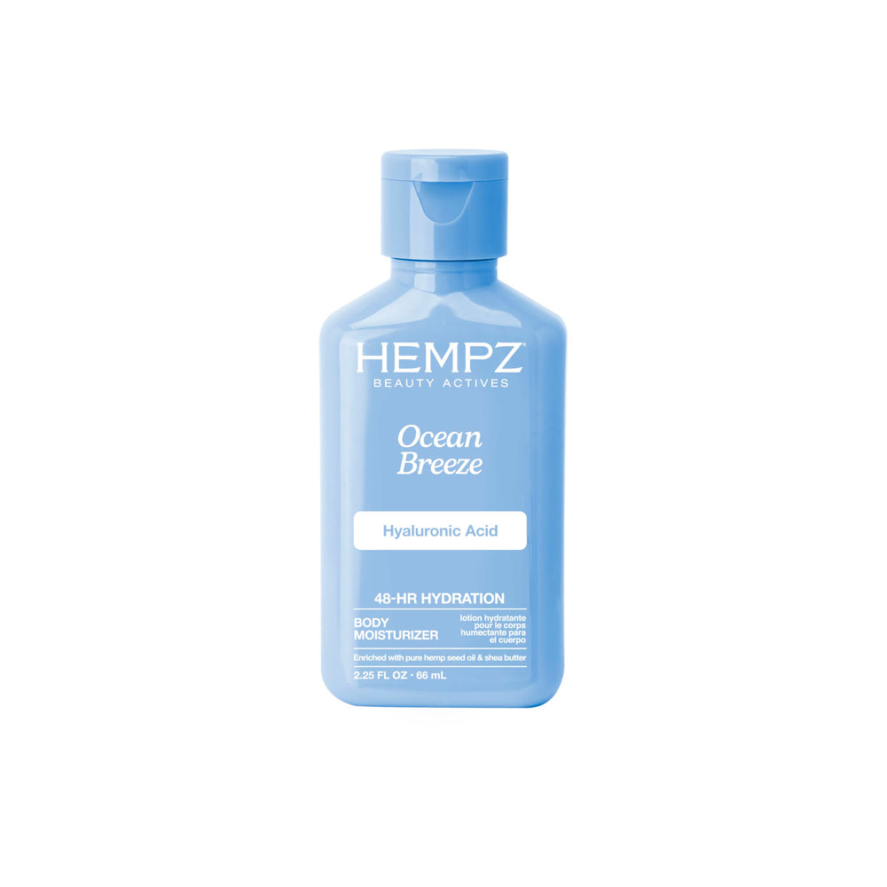 Hempz Loción corporal Ocean Breeze mini en envase, ideal para hidratación diaria.