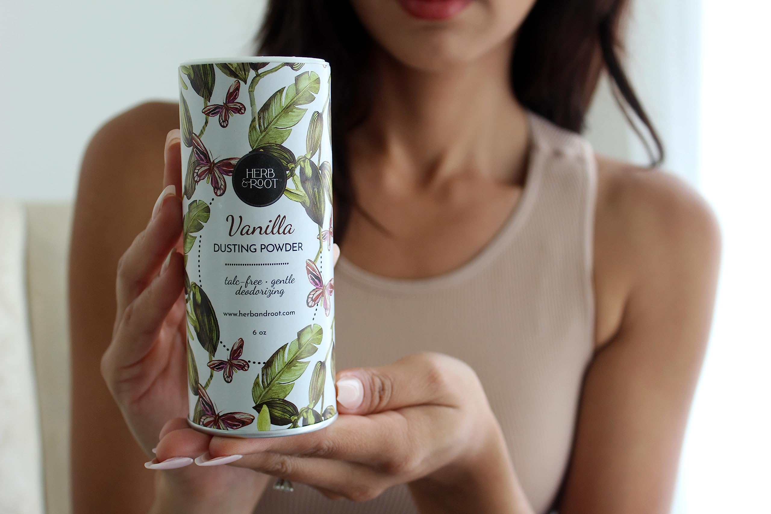 Herb & Root lavender talc-free powder on skin highlighting soothing scent.
