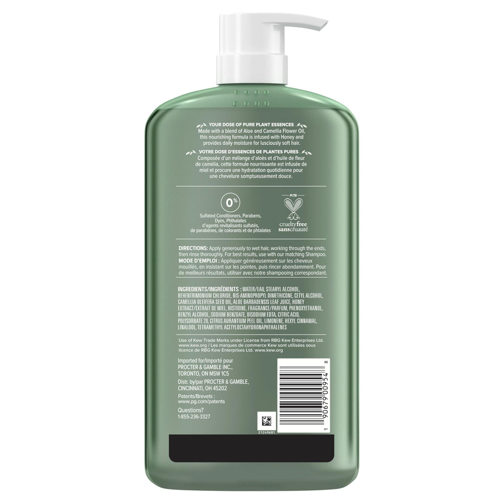 Hands applying Herbal Essences Honey Daily Moisture Conditioner to wet hair
