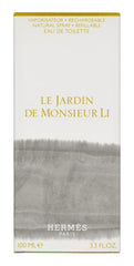 Hermès Le Jardin de Monsieur Li in a garden setting, evokes fresh daytime wear.