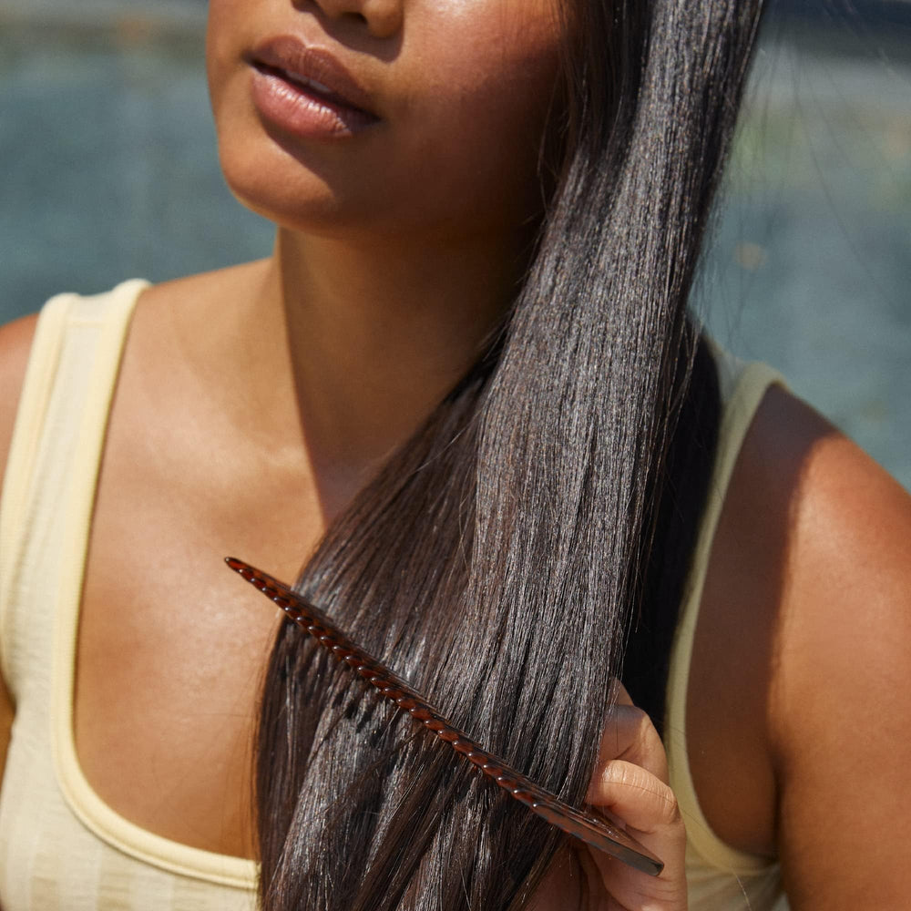 Hers Volume close-up spotlights fuller-looking hair after use.