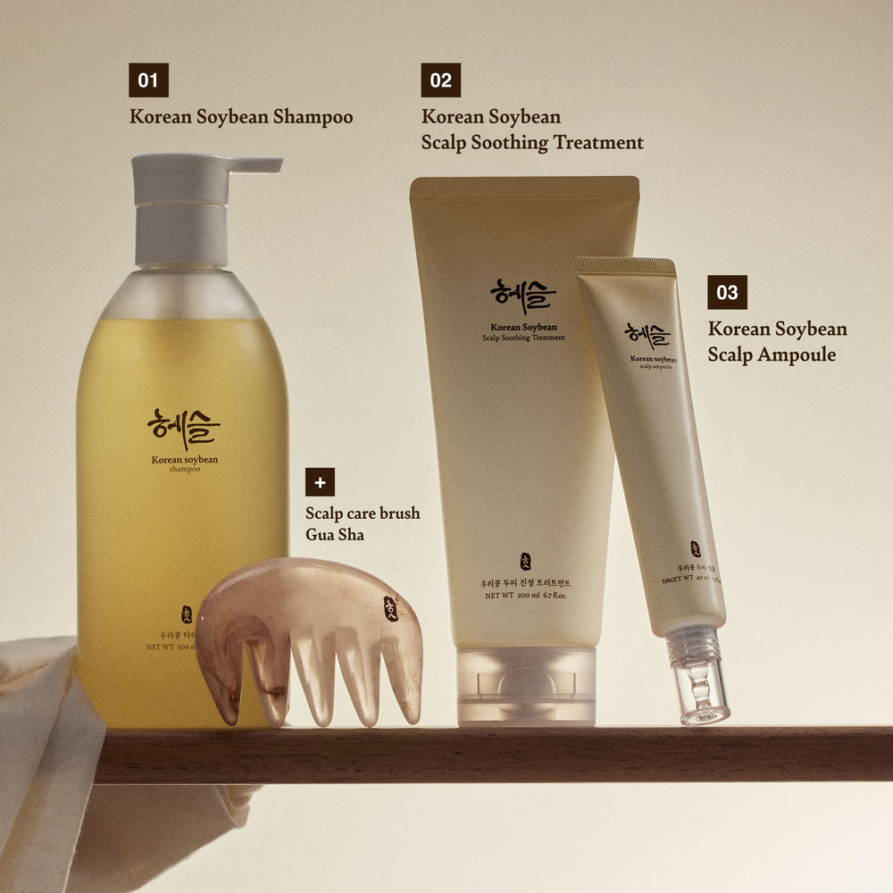 Hands applying Hesul shampoo during shower for scalp care.