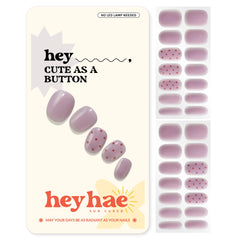 Heyhae semi-cured nail strips in dusty mauve with red polka dots for quick style.