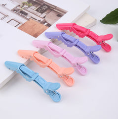HH&LL double-hinged clip grips multiple strands for braids.
