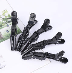 HH&LL multipurpose clip holds sections without pulling or denting hair.