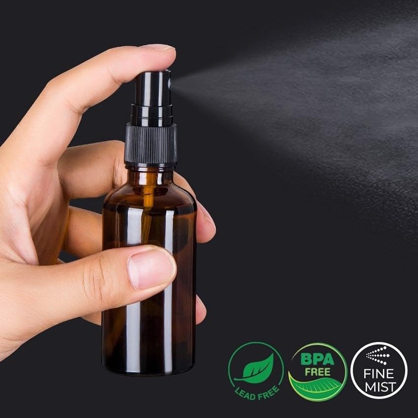hmaimas amber glass bottle close-up with mist sprayer for essential oils