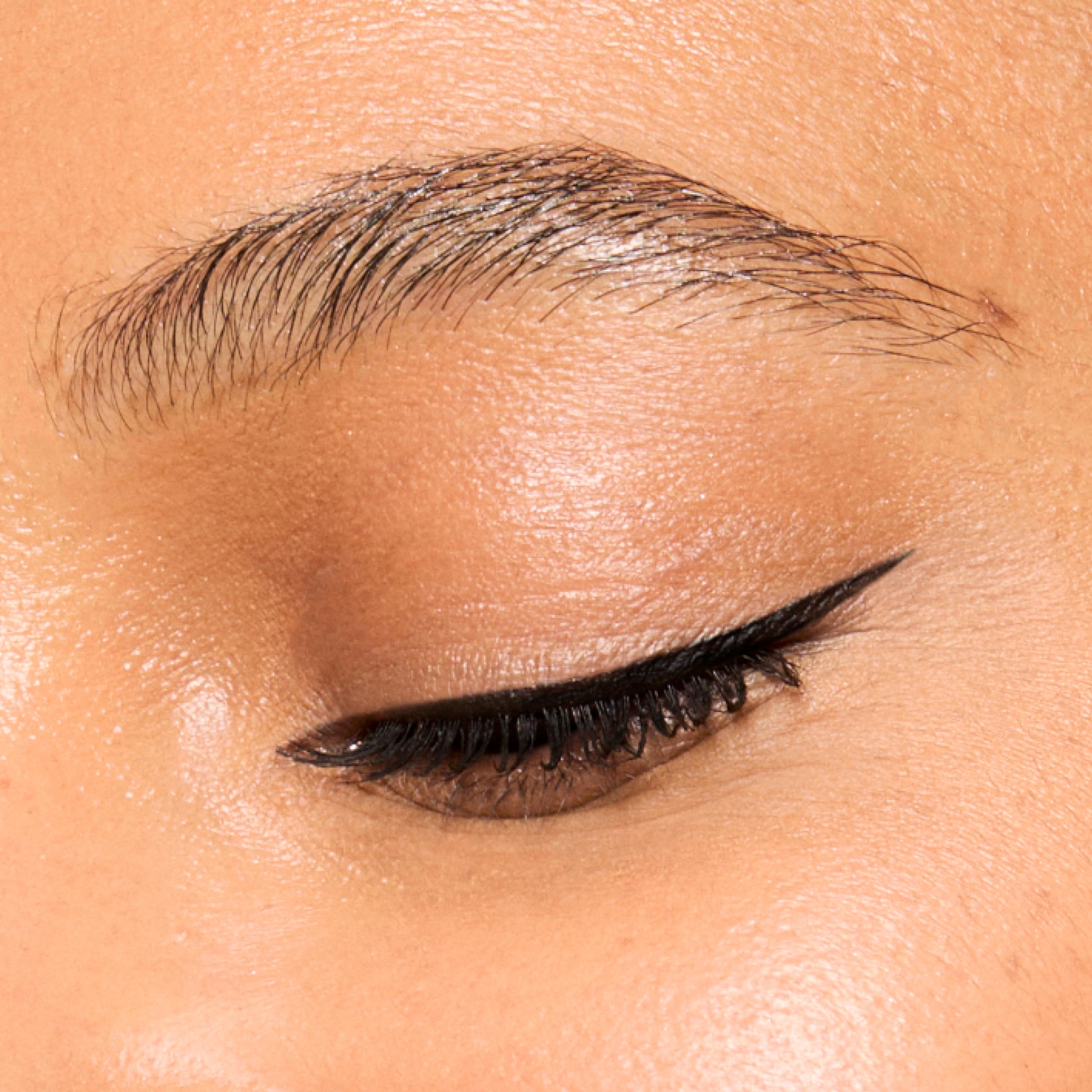 Honest Beauty Longlasting Liquid Eyeliner precise wing stroke on eye illustration.