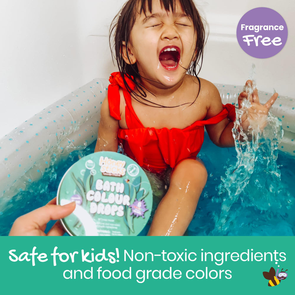 Honeysticks Bath Color Drops show blue, red, yellow colors in tub.