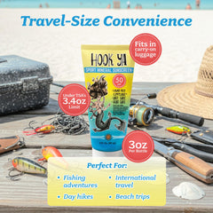 Applying Hook'Ya reef-safe sunscreen before swimming for skin protection.