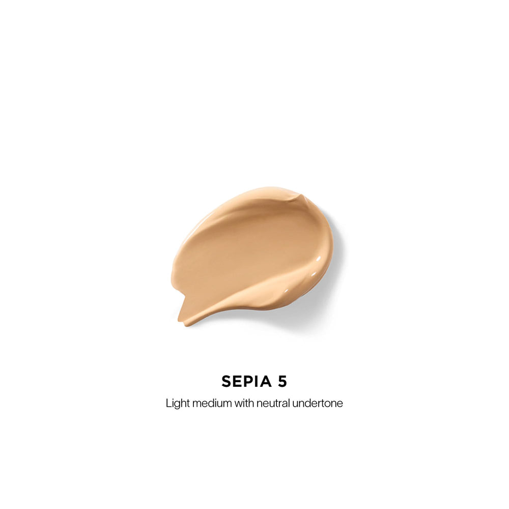 Hourglass Vanish Airbrush Concealer applicator delivering precise coverage.