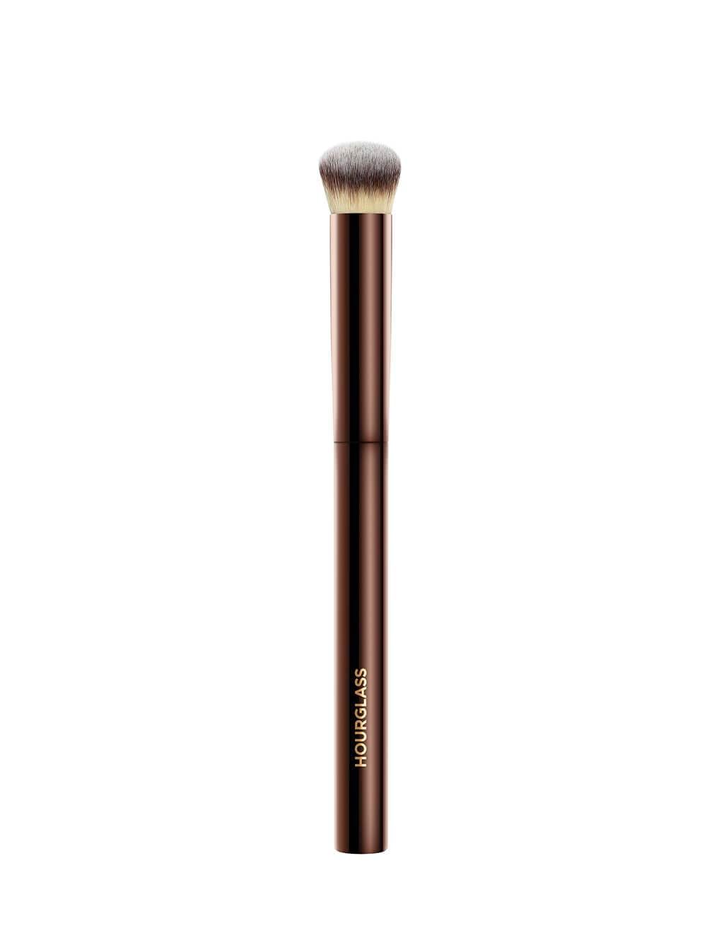 Hourglass Vanish Concealer Brush closeup shows half-moon shape for precise, seamless blending