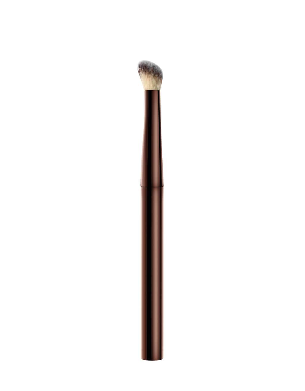 Hourglass Vanish Concealer Brush half-moon design reaches corners for even coverage