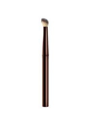 Hourglass Vanish Concealer Brush half-moon design reaches corners for even coverage
