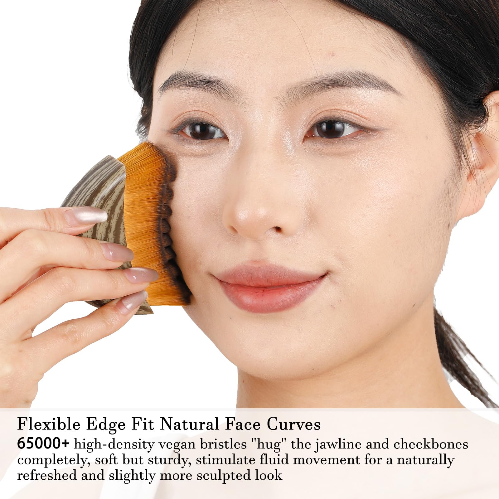 Hoyecl No Oil brush pressed on cheek demonstrates gentle massage.