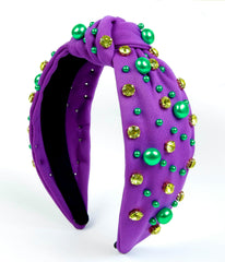 Diadema Huachi Mardi Gras con nudo morado y perlas verdes para fiesta.