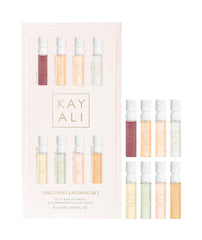 Huda KAYALI Discovery Layering Set with eight 1.5 mL samples for versatile layering.