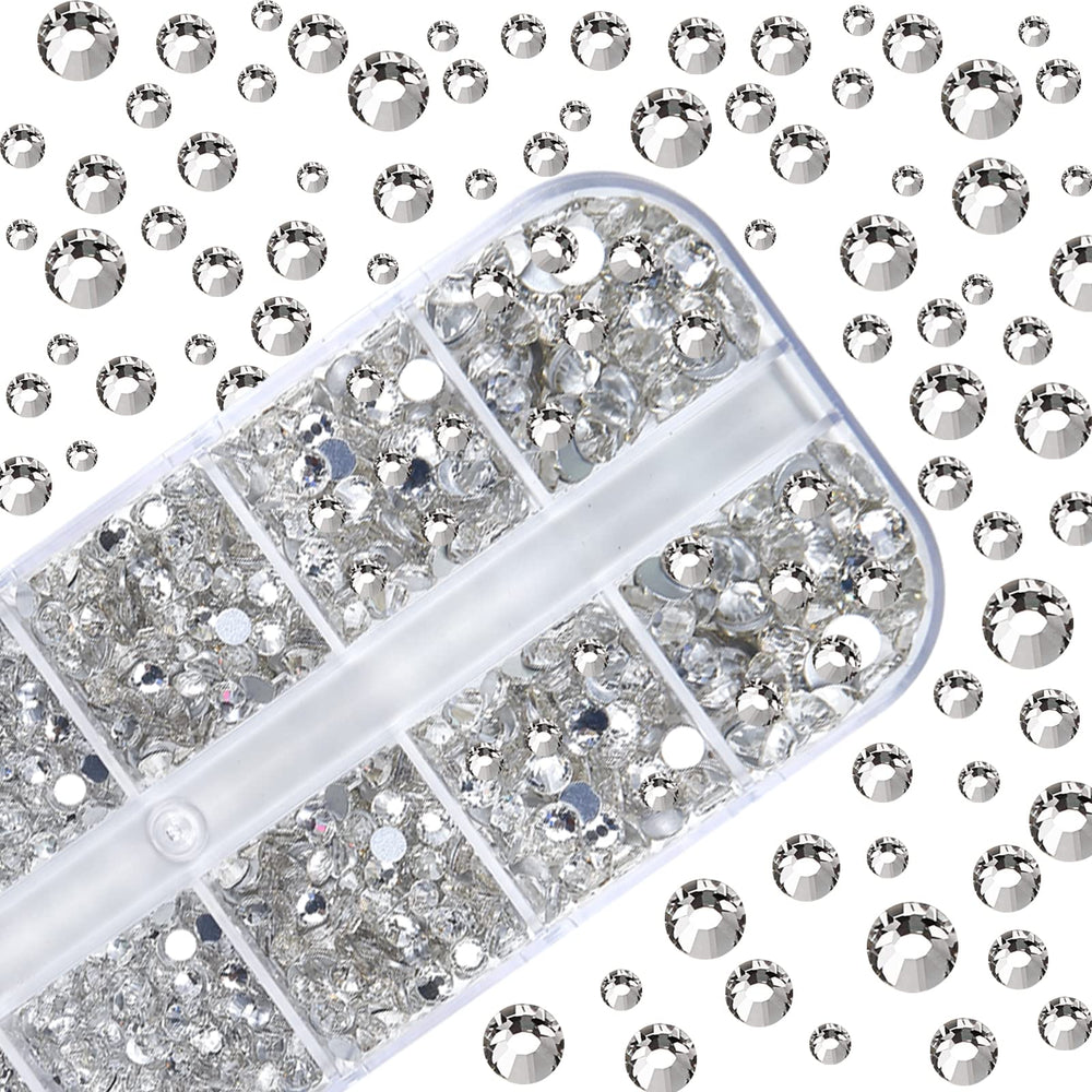 HUETFAT tweezers gripping rhinestones for quick nail art application.