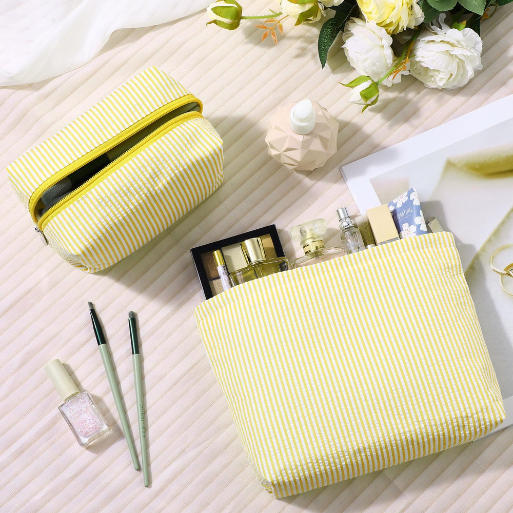 Huhumy seersucker makeup bag yellow side view; compact travel companion for cosmetics.