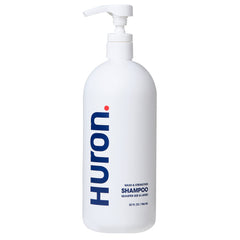 Huron Men’s Fresh Scent Daily Shampoo bottle close-up highlighting a hydrating formula.