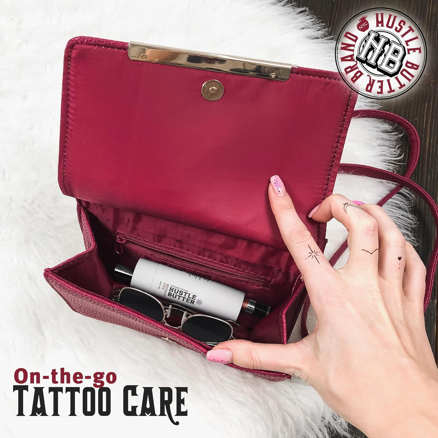 Closeup glide of Hustle Butter Deluxe tattoo aftercare stick providing targeted hydration.