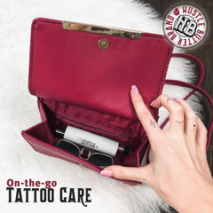 Closeup glide of Hustle Butter Deluxe tattoo aftercare stick providing targeted hydration.