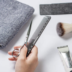 HYOUJIN 605 carbon fiber comb shows 14 holes for even tension and control.
