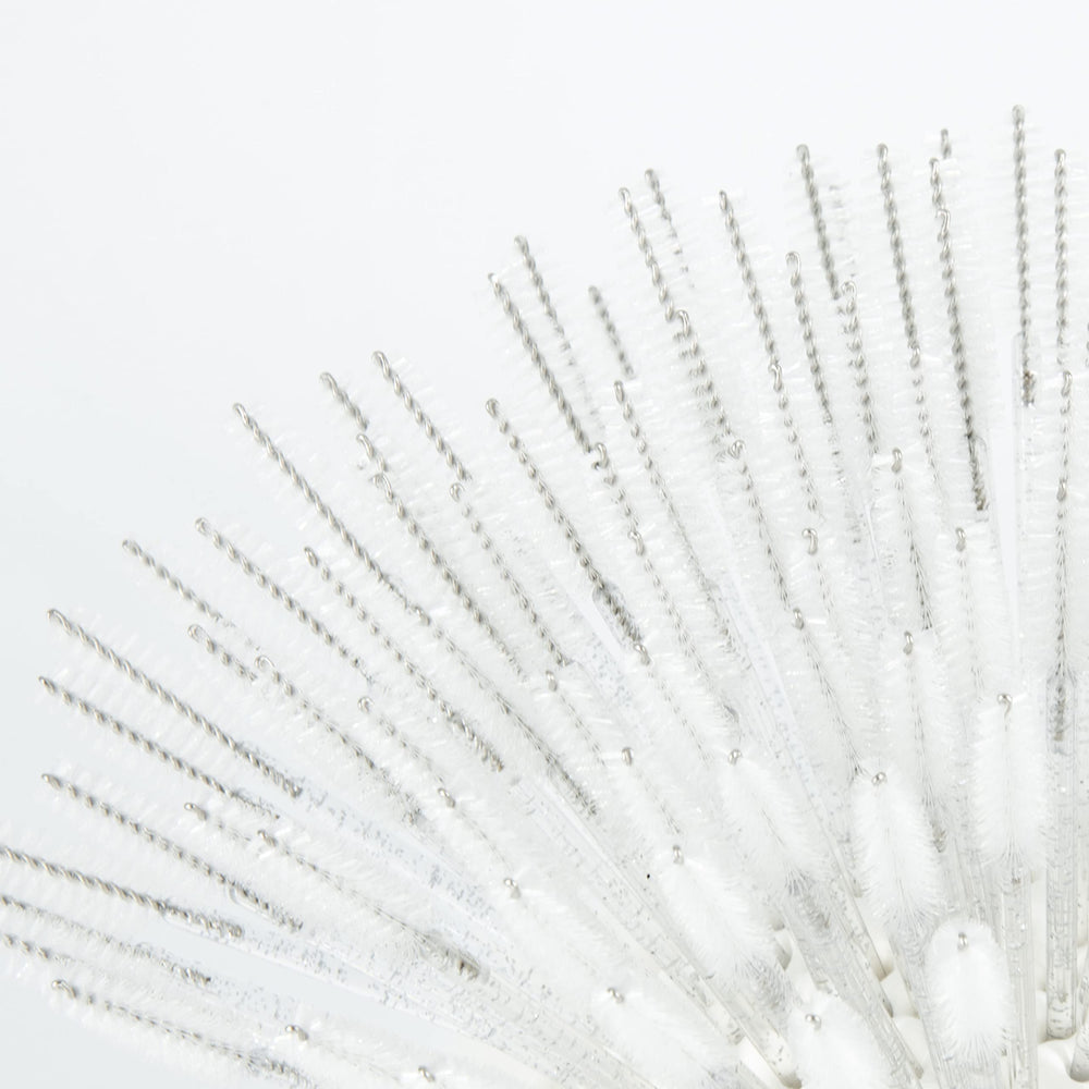 i-Laesh close-up of spiral head brush delivering precise lash grooming.