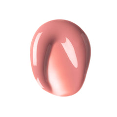 Applying ILIA Balmy Gloss Lip Oil for smooth, non-sticky color.