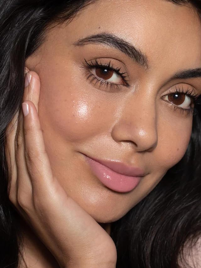 ILIA Balmy Gloss Lip Oil on lips with glossy finish and moisture.