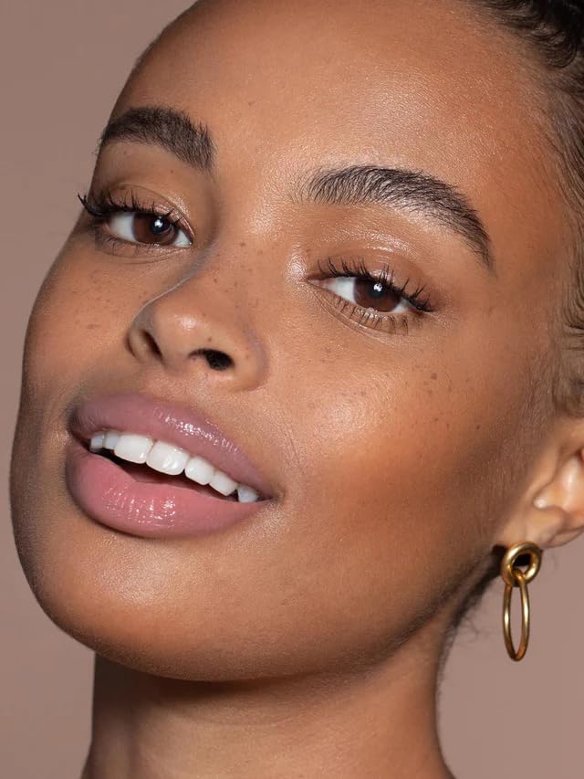 Lips wearing ILIA Balmy Gloss Lip Oil with a soft, natural tint.