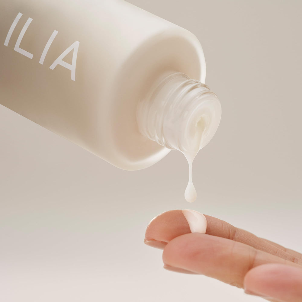 Eco-friendly packaging of ILIA Base Face Milk Essence emphasizes sustainability