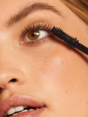 ILIA wand applying mascara for smooth, clump-free coats