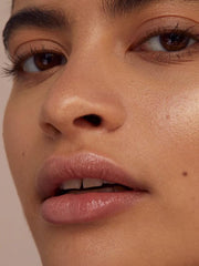 Night-time application scene demonstrating indulgent care for overnight lip renewal.