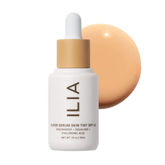 ILIA Super Serum Skin Tint SPF 40 bottle on vanity for dewy protection