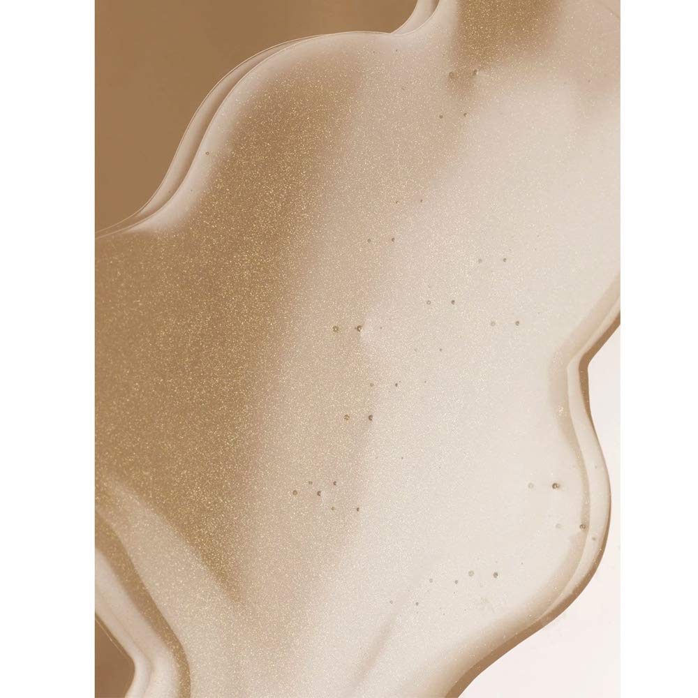 Close-up of ILIA serum application gliding onto skin for a smooth base