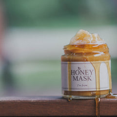 Applying Im from Honey Mask on the face for a wash-off treatment
