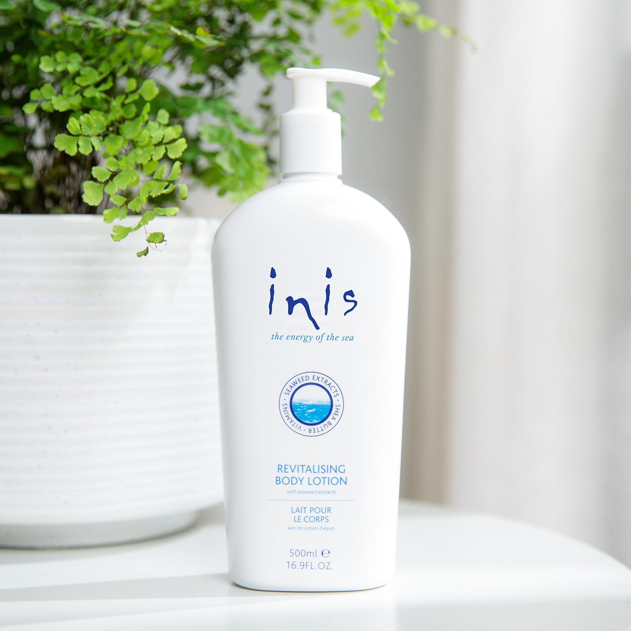 Close-up of Inis body lotion cream texture for smooth skin nourishment