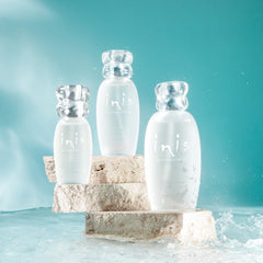Shell-shaped cap on the bottle evokes beach days and oceanic freshness.