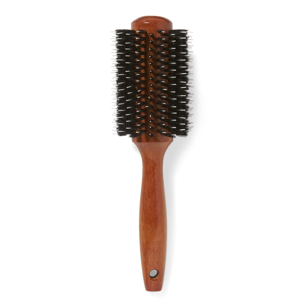 Ion Golden Wood Round Brush Large helps tame frizz for sleek results.