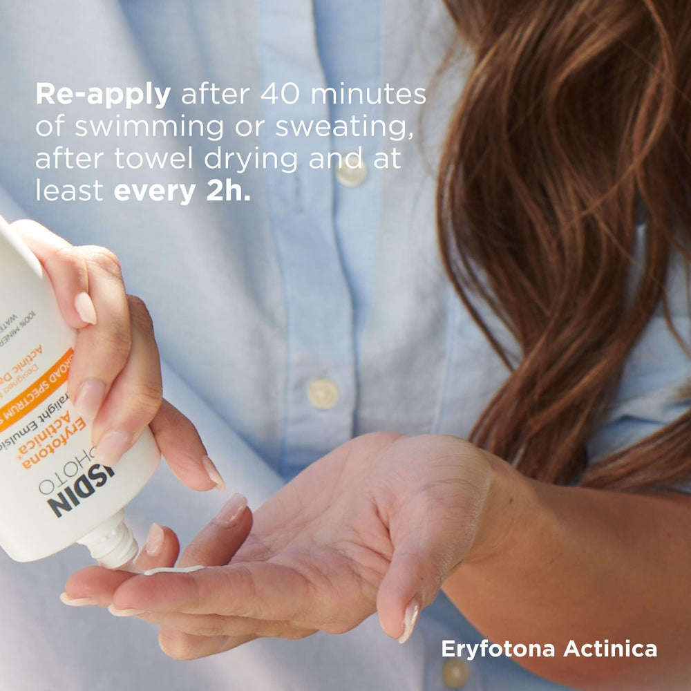 Application on the face with ISDIN sunscreen under makeup