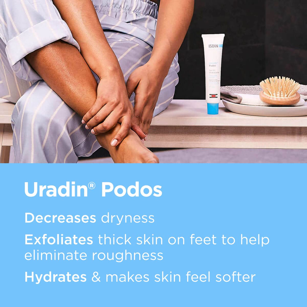 ISDIN Uradin Podos Gel Oil being spread on the foot to soften rough skin.