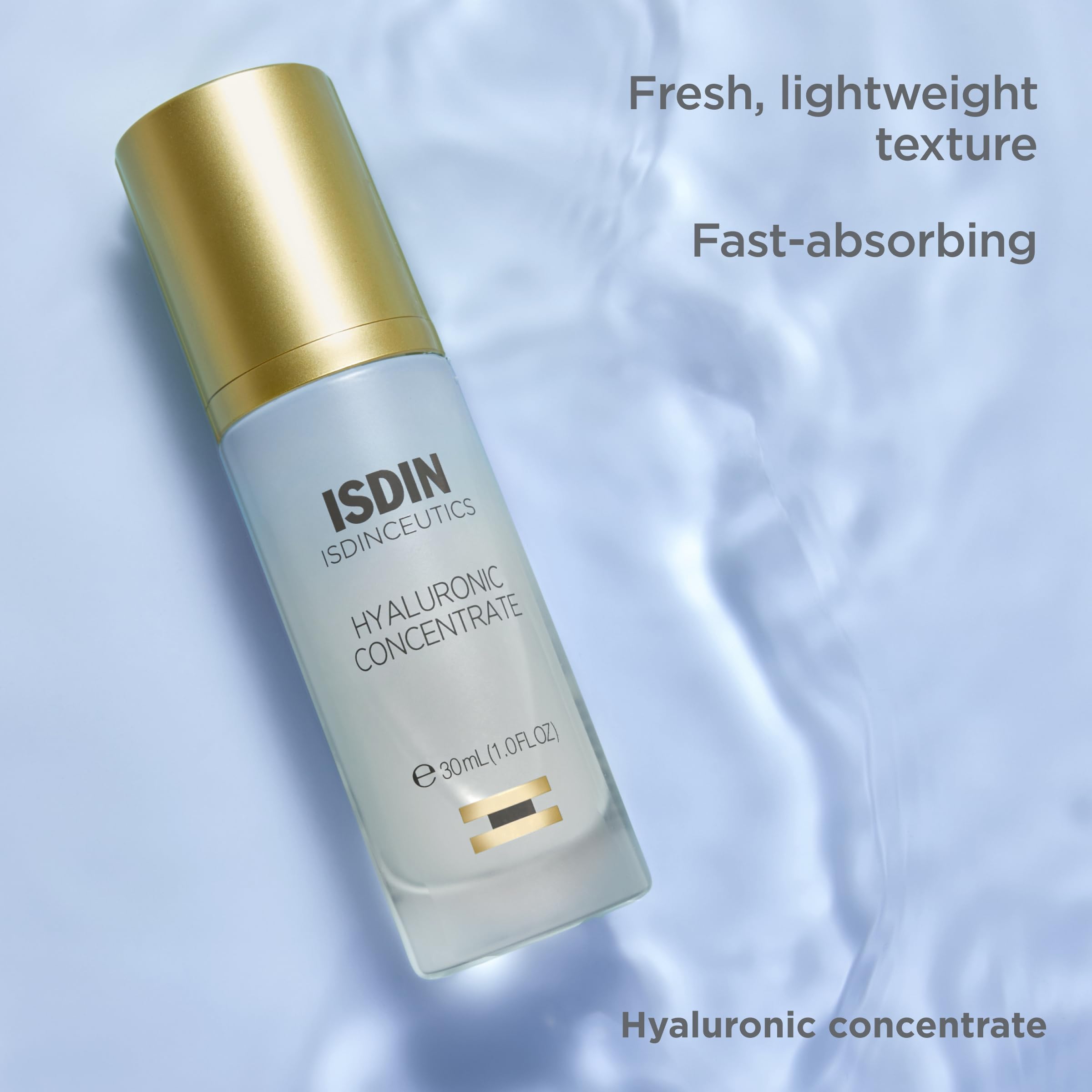 Applying Isdinceutics Hyaluronic Concentrate to cheek for quick hydration