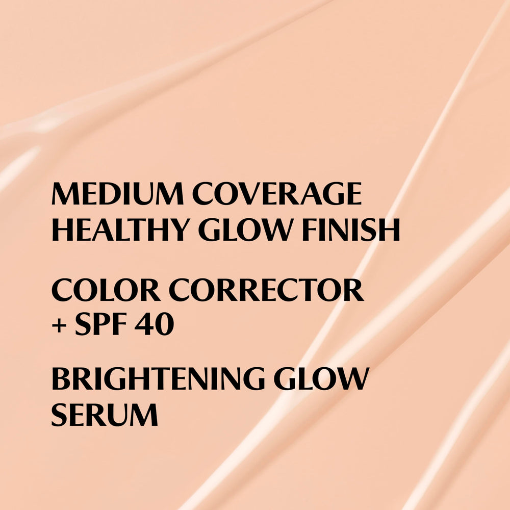 Brightening serum texture visible on IT Cosmetics CC+ Nude Glow skin.