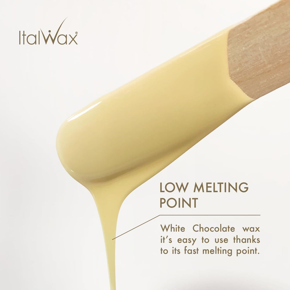 Spatula applying Italwax beads in a warm setup for even coverage.