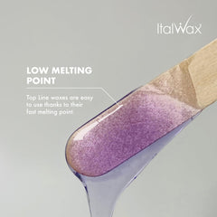 Italwax Orchid wax beads showing transparent jelly texture for visibility during application.