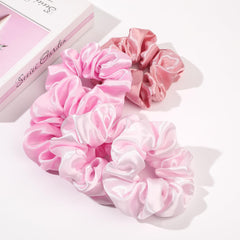 Ivyu silk satin scrunchie worn on wrist for easy access.