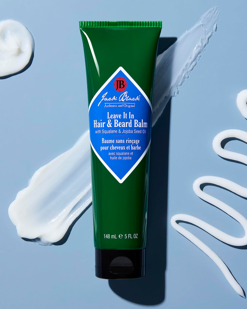 Jack Black Leave It In Hair & Beard Balm dispenser close-up showing quick absorption.
