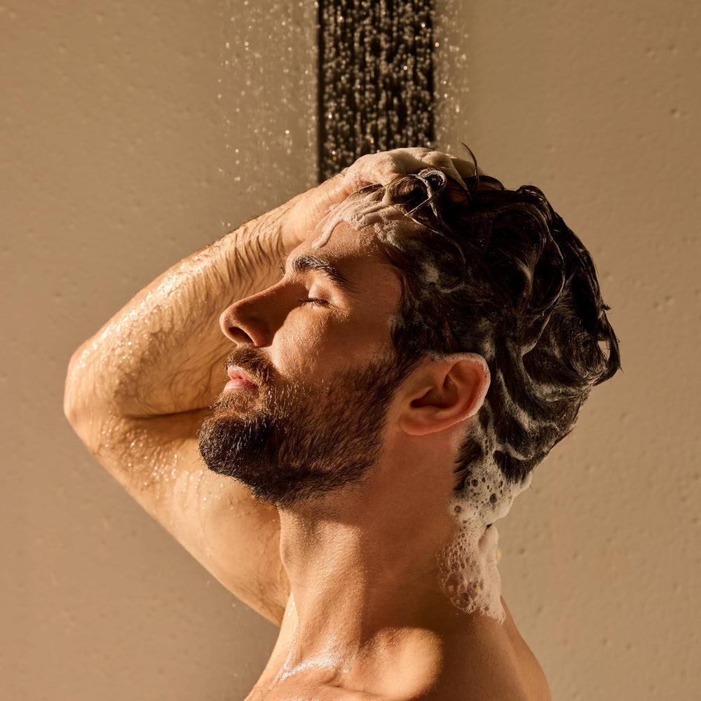 Jack Black PureScience formula bottle highlights coconut oil and kelp for nourished scalp.