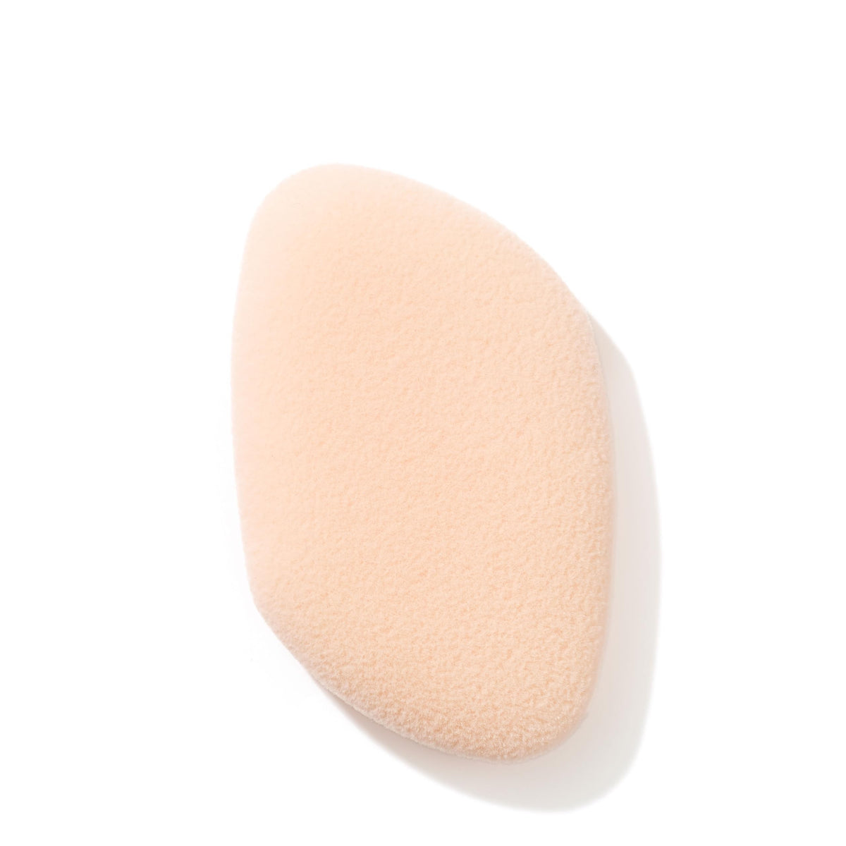 Jane Iredale flocked sponge blender close-up for seamless mineral application.