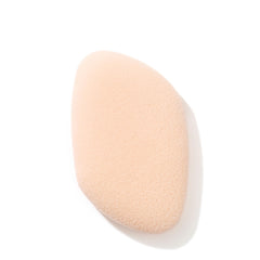 Jane Iredale flocked sponge blender close-up for seamless mineral application.